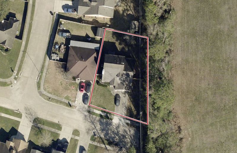 Aerial photo of 6311 Rocky Nook Dr, lot outlined in red