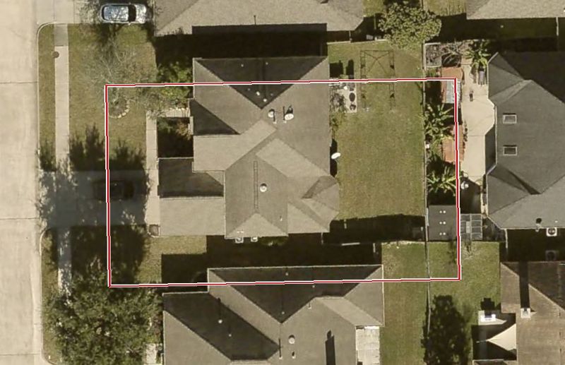 Aerial photo of 5207 Rainier St, lot outlined in red