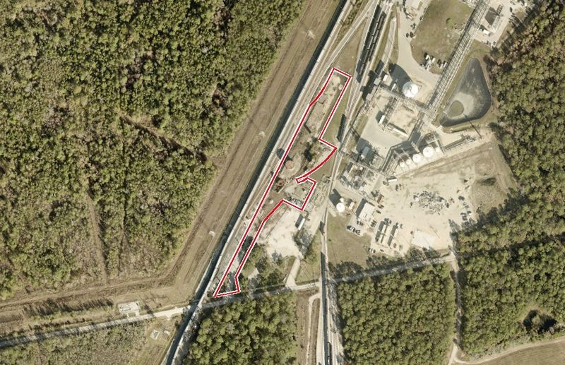 Aerial photo of 9400 Needlepoint Rd, lot outlined in red