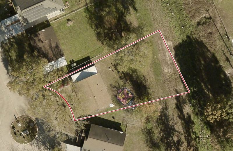 Aerial photo of 9327 Courben Cir, lot outlined in red