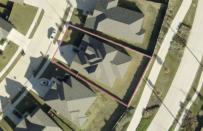 Aerial photo of 5306 Mystic Sea Dr, lot outlined in red