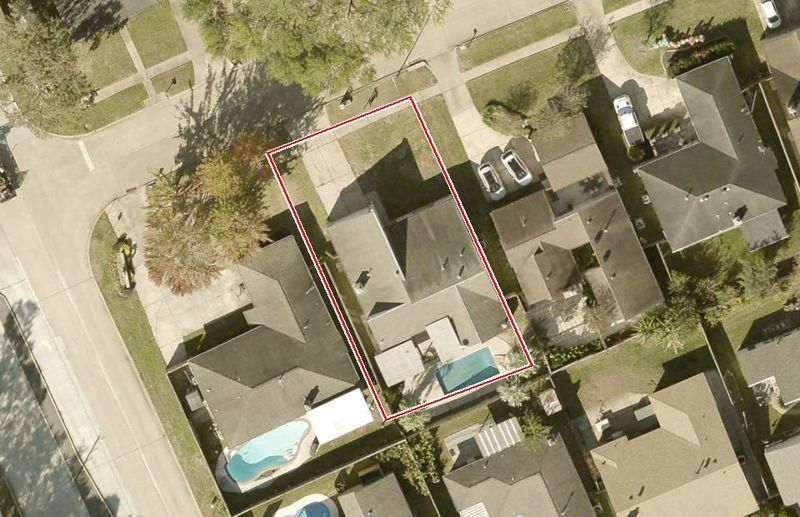 Aerial photo of 15706 Dunmoor Dr, lot outlined in red