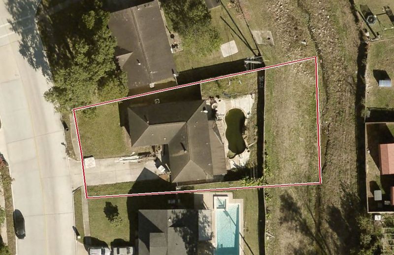 Aerial photo of 7910 Royalwood Dr, lot outlined in red