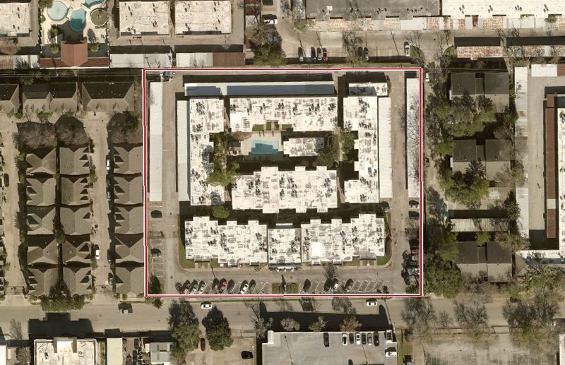 Aerial photo of 6220 Fairdale Ln 101, lot outlined in red